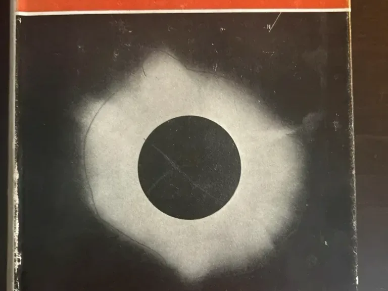 Red-and-black dust jacket for Fred Hoyle’s The Nature of the Universe, with the title and author’s name centred on the cover