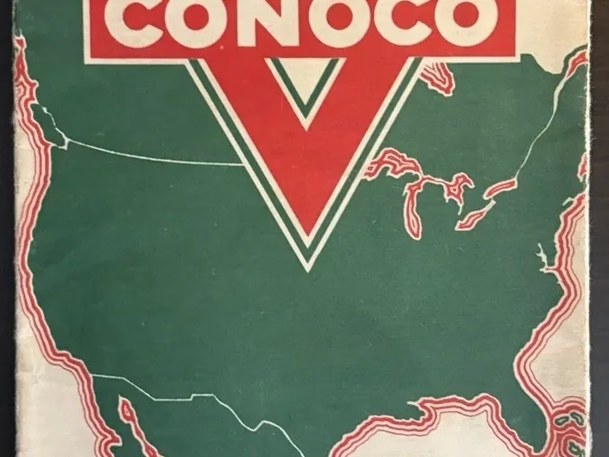 Folded Travel Colorado road map cover with a red Conoco triangle over a green outline of North America