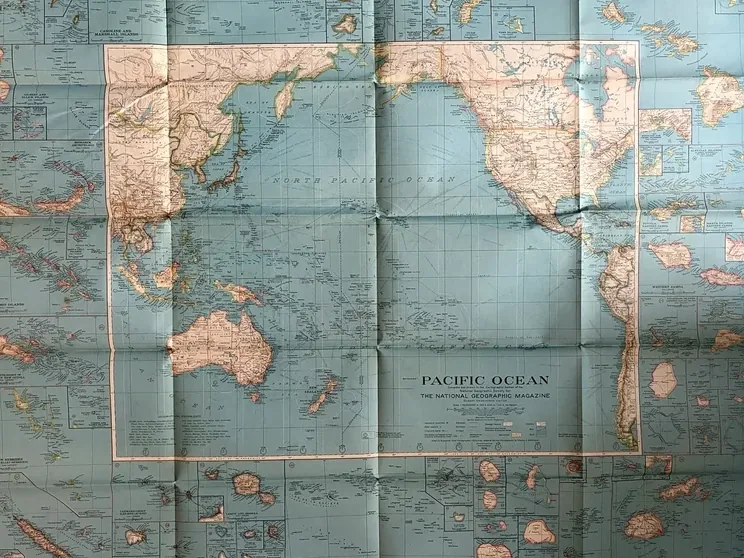 Complete unfolded National Geographic map of the Pacific Ocean dated December 1936, centred on the ocean and surrounded by island insets