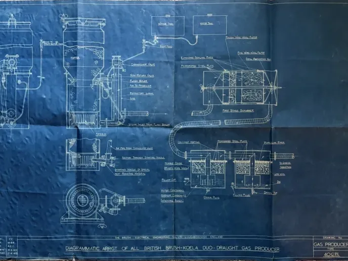 Blue engineering drawing of a Brush-Koela duo-draught gas producer with labelled sections and pipework