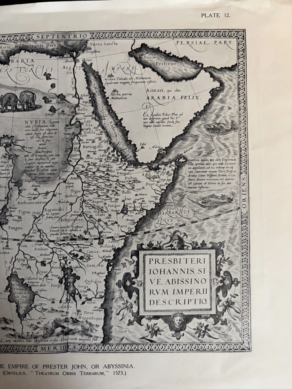 Right portion of the Prester John reproduction showing Arabia, the Red Sea, title cartouche, mountains, a sea creature, Plate 12 and part of the English caption.