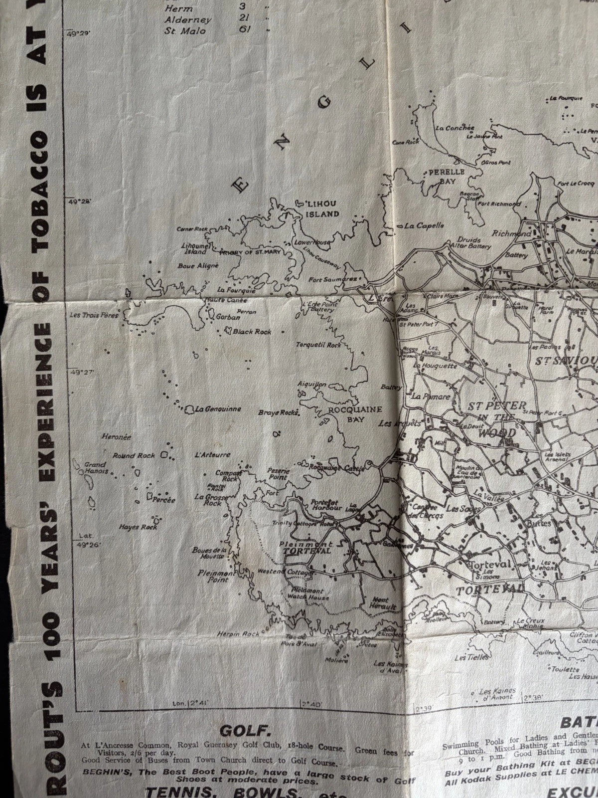 Western Guernsey map detail with Lihou, Perelle Bay, Rocquaine Bay, Torteval and printed notes for golf and bathing.