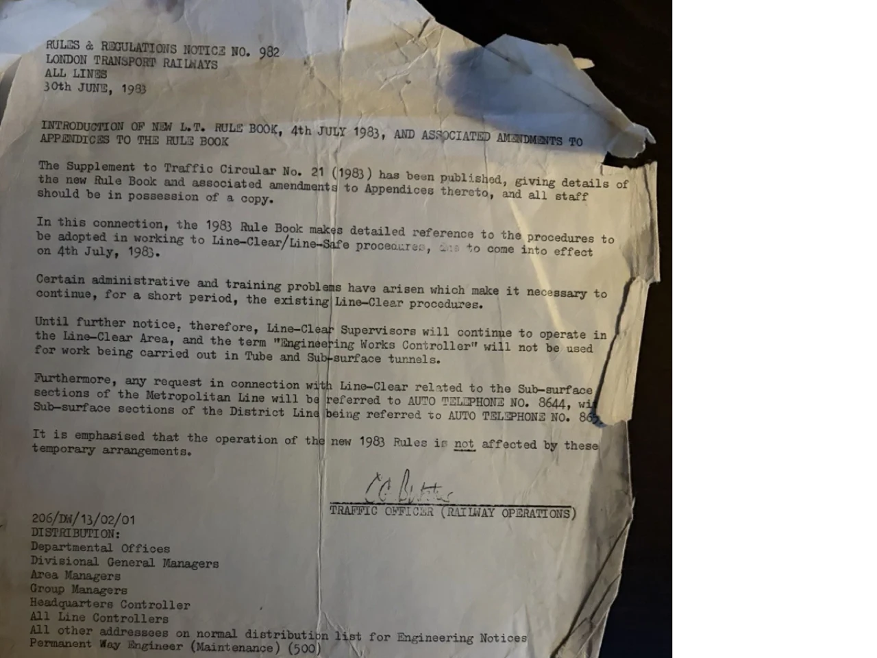 Worn 1983 London Transport notice announcing the new railway rule book