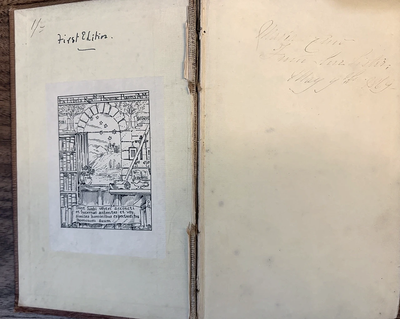 The front opening with a pictorial bookplate, May 1859 inscription and exposed front inner hinge