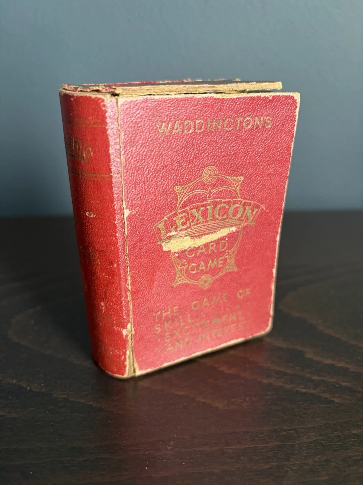 Red book-form box for Waddington's Lexicon card game, marked The Game of Skill
