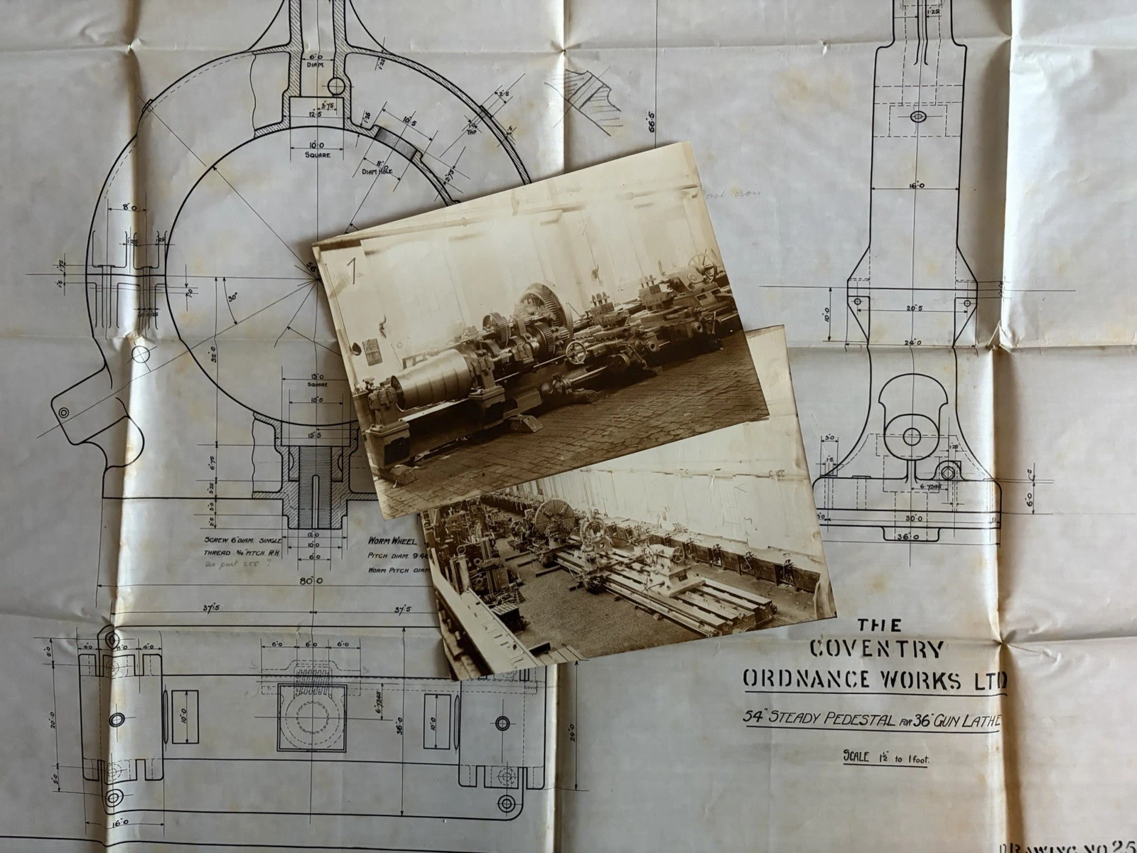 1906 Coventry Ordnance Works gun-lathe blueprint with two historic workshop photographs laid over the drawing